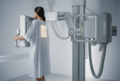 Hospital,Radiology,Room:,Beautiful,Multiethnic,Woman,Standing,In,Medical,Gown